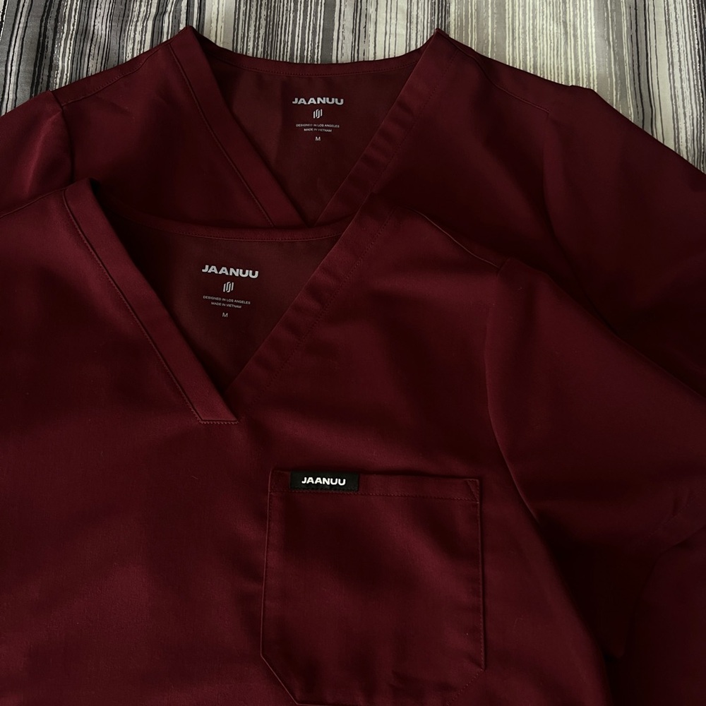 i’m selling two Jaanuu scrub tops.